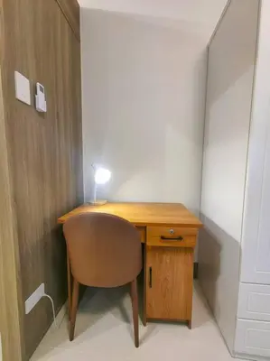 a desk with a chair and a lamp on top of it at 1BR Condotel with Balcony at FAME Residences #FM47 in Manila