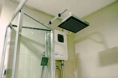 a shower in a bathroom with a glass shower stall at Hotel style Unit 2924 Fame in Manila
