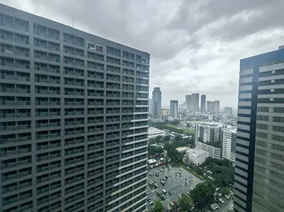 a view of a large building in a city at 1BR Condotel with Balcony at FAME Residences #FM52 in Manila