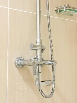 a shower with a water hose in a bathroom at 823 Air Condo Shell Staycation Mall of Asia Walkable in Manila