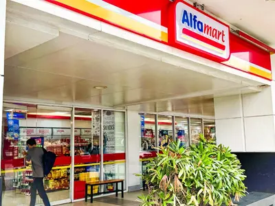 a man walking in front of a store at 823 Air Condo Shell Staycation Mall of Asia Walkable in Manila