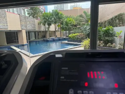 a view of a swimming pool from the inside of a vehicle at Mi Casa - Cozy Studio with FREE access to Fitness Centre, swimming pool and stunning City View located near the CBD of Ortigas, Makati, BGC in Manila