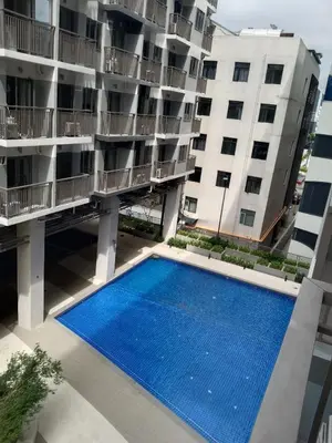 an aerial view of an apartment building with a swimming pool at The Manor at S Residences in Manila