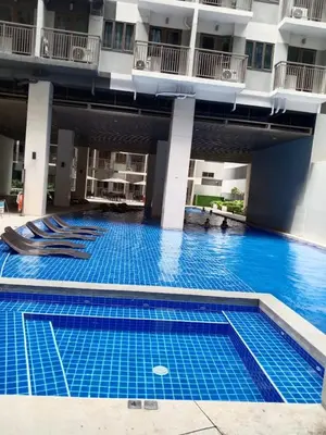 a swimming pool in the middle of a building at The Manor at S Residences in Manila