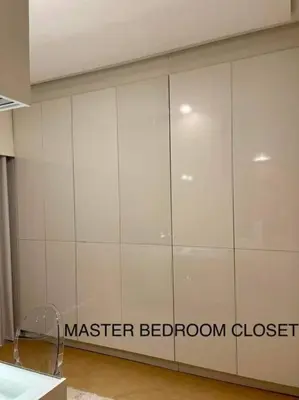 a large white wall with the master bedroom closet at 3BR Elegant & Central Loc- Netflix, WiFi, MiniBar! in Manila