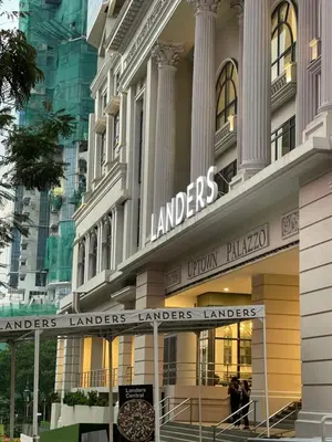 a building with a sign that reads london landmarks luton palace at Cozy place across Mitsukoshi Mall in Manila