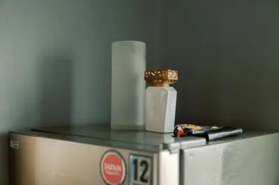 a counter with a container and a roll of paper towels at Cozy and Spacious Studio at SOMA BGC Near SM Aura and Bonifacio High Street in Manila