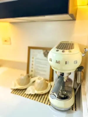 a mixer sitting on top of a counter with saucers at Natural Haven at South in Manila