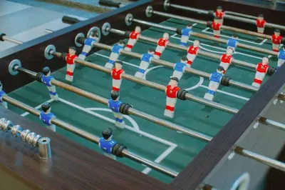 a close up of a snooker table with people on it at The One with Purple Apartment in Manila