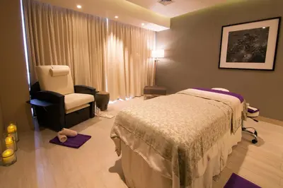 a hospital room with a bed and a chair at City of Dreams - Nobu Hotel Manila in Manila