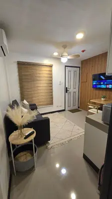 a living room with a couch and a table at Flat 35, Unit D in Manila