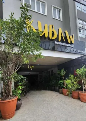 a building with aazon sign on the side of it at Vintage charm meets modern relaxation near Araneta in Manila