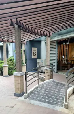a building with a sign that says b on it at 1BR with Balcony Condo accross NAIA T3 in Manila
