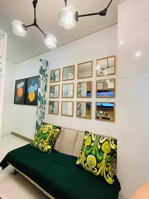 a living room with a couch in a room at Coast Stay by J 41st floor Penthouse in Manila