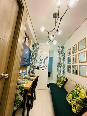 a room with a table and a dining room at Coast Stay by J 41st floor Penthouse in Manila