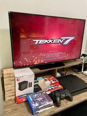 a television sitting on top of a table with video games at 1 Bedroom Azure Staycation Near NAIA in Manila