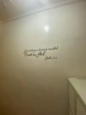 a sign on a wall with a writing on it at Cernardo's Staycation Place 1 near Enchanted Kingdom in Ibaba