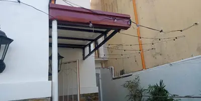 an empty room with awning and a building at Cernardo's Staycation Place 1 near Enchanted Kingdom in Ibaba