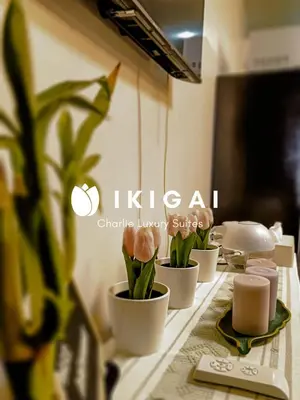 a table with four cups with flowers in them at Ikigai Charlie Makati Condo Premium Comfort & Luxury in Manila