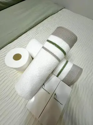 a roll of toilet paper sitting on a bed at Shore 3 katkat staycation in Manila