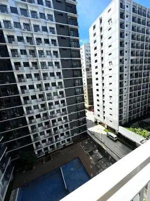 an aerial view of two tall buildings in a city at Shore 3 katkat staycation in Manila