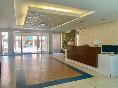 an office with a lobby with a reception desk at Tiaras Luxury Condotel in Manila