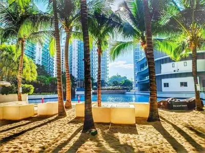 a resort with palm trees and a pool at Azure Resort Paranaque deluxe room unit 1601 st tropez tower in Manila
