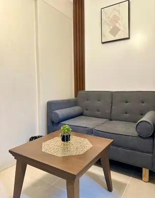 a living room with a couch and a coffee table at Marias Crib in Manila