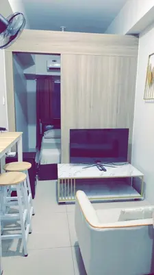 a room with two beds and a tub in it at Staycation by Estelle in Manila