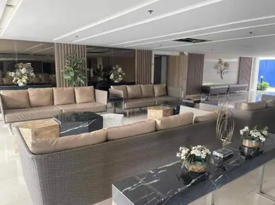 a large living room with couches and tables at Staycation by Estelle in Manila