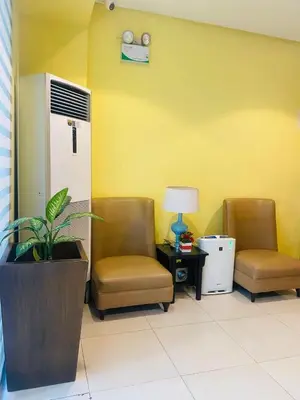 a waiting room with two chairs and a table at One palm tree villas &Two palm tree villas in Manila