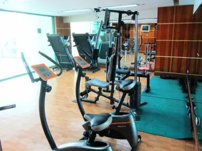 a gym with several exercise bikes in a room at Condo With Balcony And Bayview In Malate, Manila in Manila
