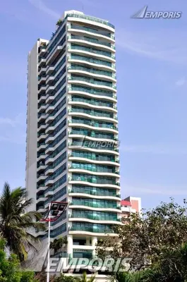 a tall building with a sign in front of it at Condo With Balcony And Bayview In Malate, Manila in Manila