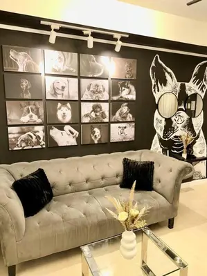 a living room with a couch and a glass table at Azure 1BR with Projector in Manila