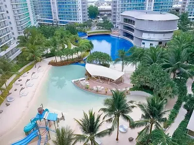 an aerial view of a resort swimming pool at Azure 1BR with Projector in Manila
