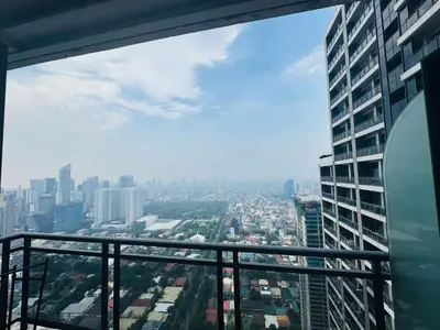 a view of a city from the top of a building at Gramercy Residences Studio with balcony Near Airport in Manila