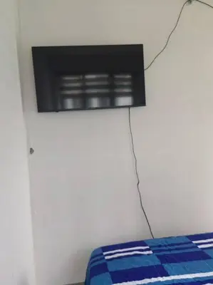 a room with a bed and a window on a wall at 2 Bedroom near MOA S Residences in Manila