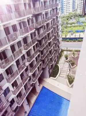 an aerial view of a building with a swimming pool at 2 Bedroom near MOA S Residences in Manila
