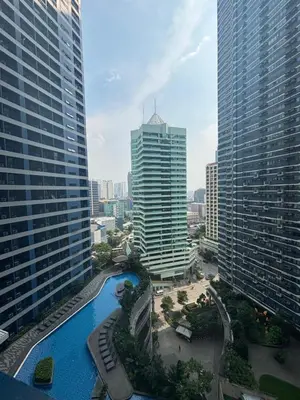 an aerial view of a city with tall buildings at Air Residences in Manila