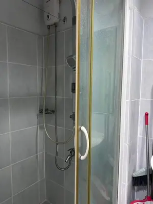 a shower in a bathroom with a glass door at Sea Residences by Richnell's Staycation 