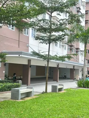 a park in front of a building with benches at Enchantress Abode in Trece Martires