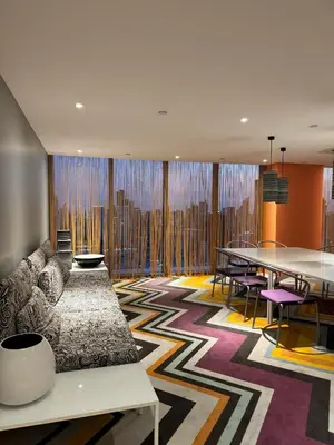 a living room with a couch and a table at The Home Ikigai in Manila