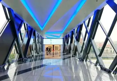 a hallway in a building with a blue ceiling at 81 Newport Boulevard-Hyuna Place, Across NAIA T3 in Manila