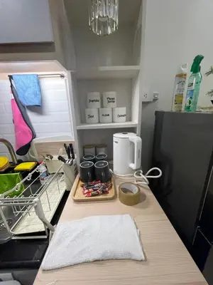 a kitchen counter with a coffee maker on it at Y&N Staycation Cozy and Aesthetic Unit near to NAIA Airport in Manila