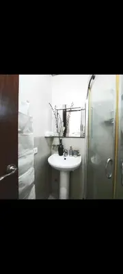 a bathroom with a sink and a shower at ApartHotel Tower22307 in Manila