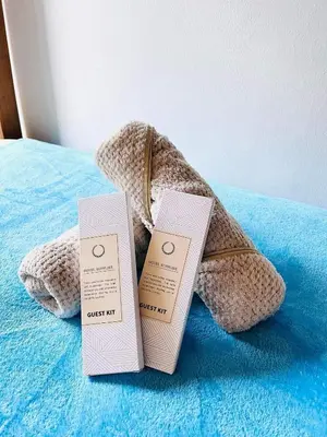 two boxes sitting on top of a bed at Azure Urban Resort Residences in Manila