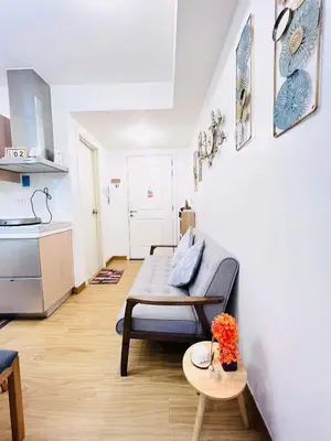 a living room with a couch and a table at Azure Urban Resort Residences in Manila
