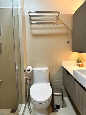 a bathroom with a toilet and a sink at Cozy and Aesthetic Condo at Shore 3 in MOA, Pasay in Manila