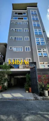 a tall building with a sign on the front of it at Coquette vibes close to Cubao's Araneta Center in Manila