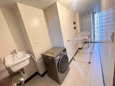 a bathroom with a toilet and a sink at 2 Bedrooms & 2 Bathrooms at BGC Taguig McKinley by Venice Grand Canal mall in Manila